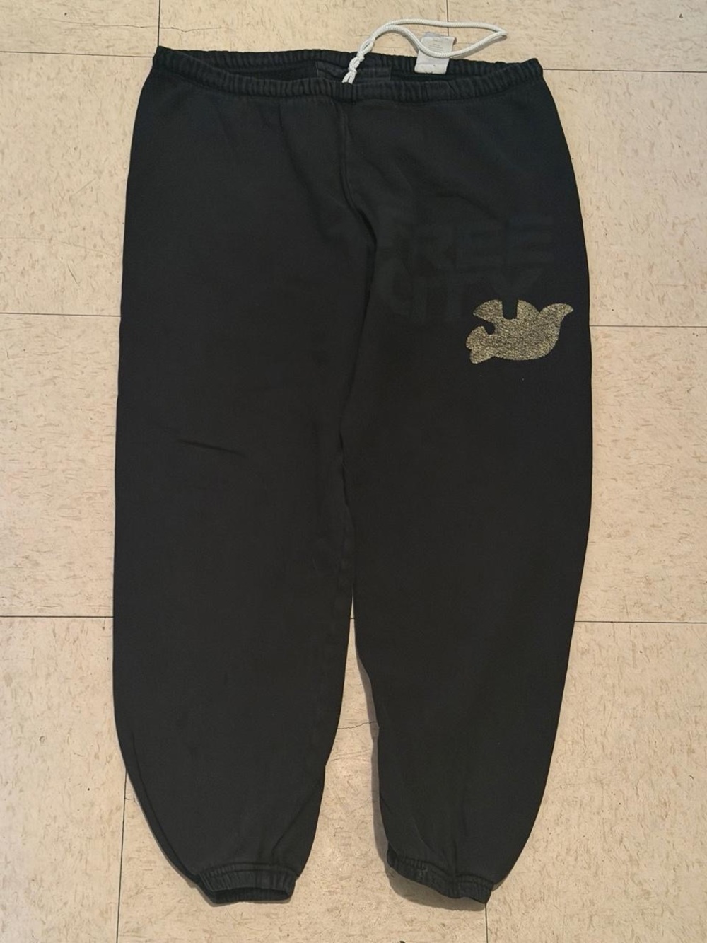 freecity Black Jogger Pants with Gold Dove Accent